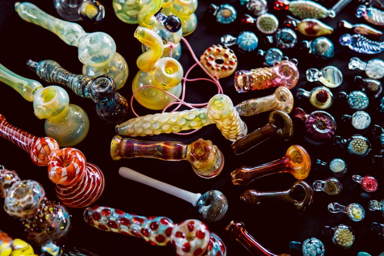 colorful assortment of glass pipes and bongs