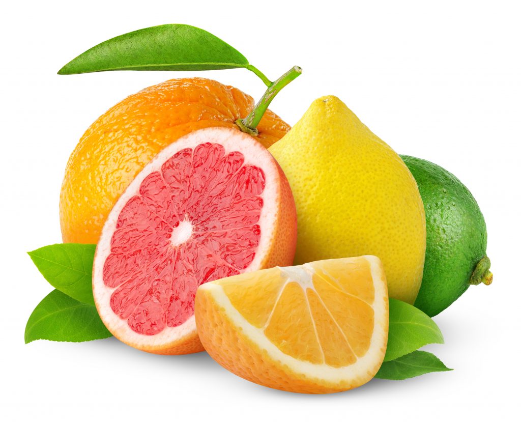 half a grapefruit, orange wedge, lemon, and lime on white background