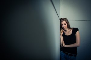 Young woman suffering from a severe anxiety and depression