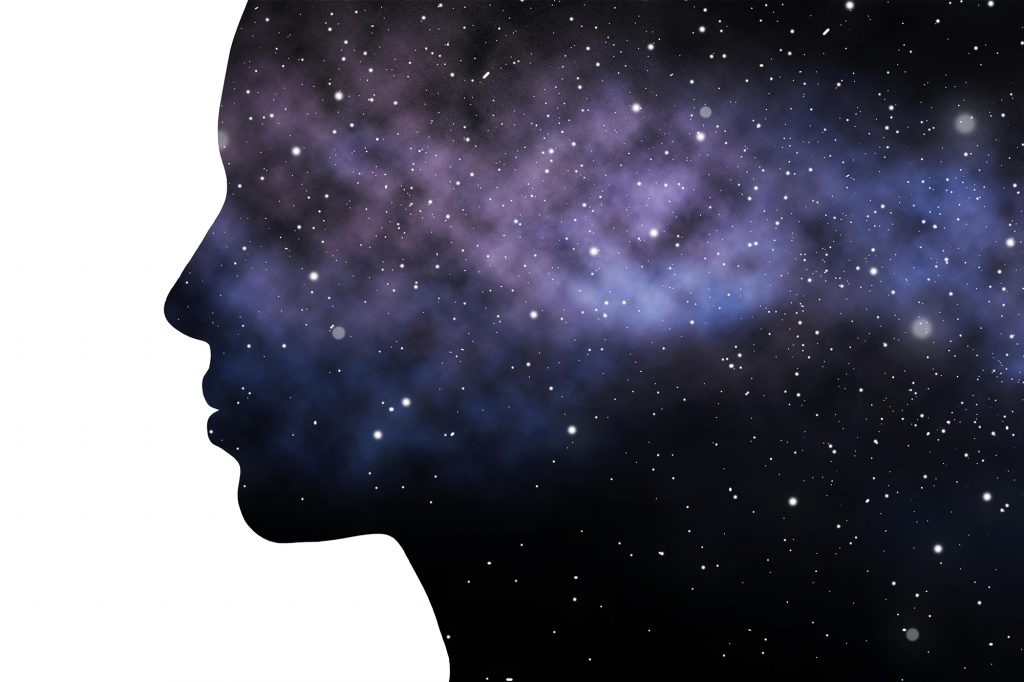 silhouette of head containing cosmos